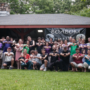 Outdoor group in front of a BOABOM sign
