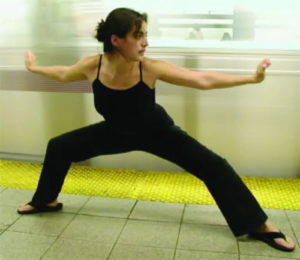 woman doing online martial arts training at home